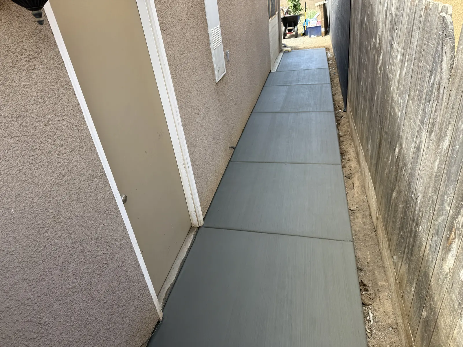 Finished walkway filling the side yard from the door out to the back gate